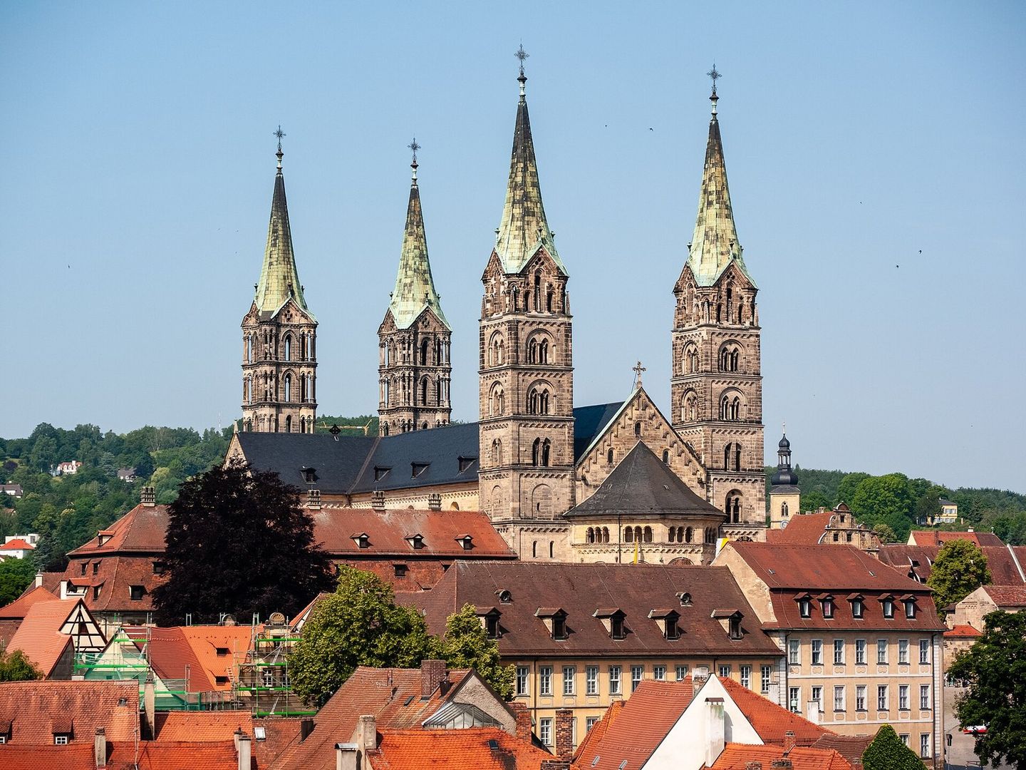 Cathedral with four towers above the rooftops